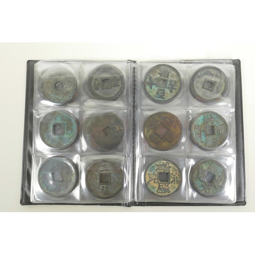 13 - A wallet of Chinese facsimile (replica) bronze coinage, 1½