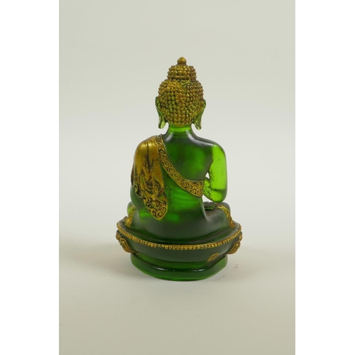 20 - A green Peking glass Buddha seated in meditation on a lotus flower, with gilt highlights, 5