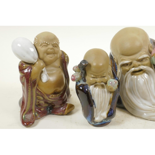 21 - Four Chinese, Shiwan style, mud men shaven head pilgrim figures, 4½