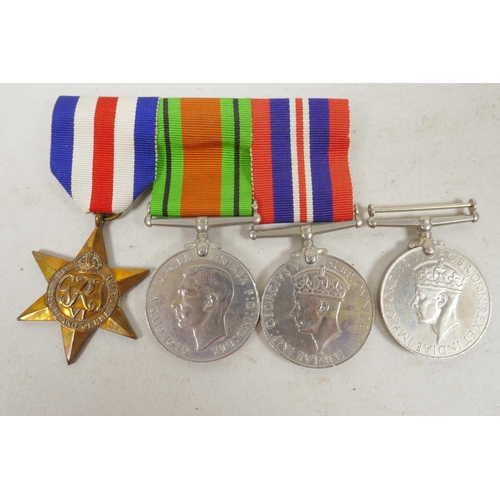 29 - A set of three British Second World War service medals together with a WW2 campaign medal