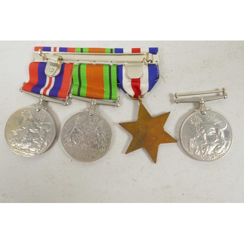 29 - A set of three British Second World War service medals together with a WW2 campaign medal