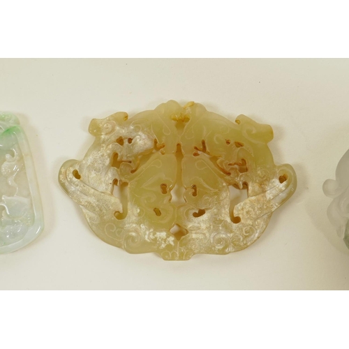 30 - Three Chinese jade and hardstone pendants with carved dragon and phoenix decoration, largest 3