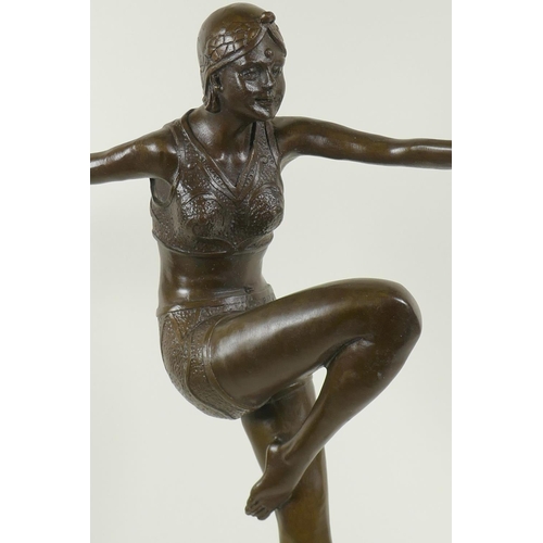 32 - An Art Deco style bronze figure of a dancing girl, on a marble plinth, 22