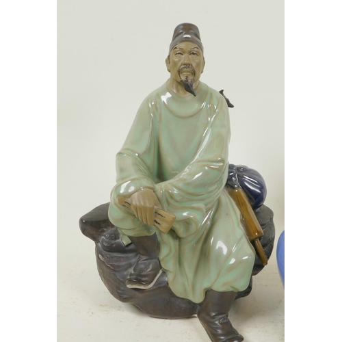 362 - Three Chinese, Shiwan style, mud men figures in green robes, largest 8