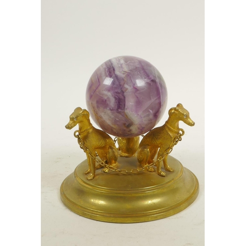 42 - A fluorspar crystal ball on a triform ormolu stand in the form of dogs, 4