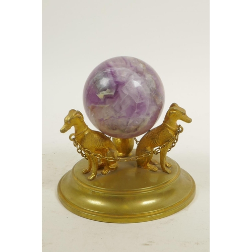 42 - A fluorspar crystal ball on a triform ormolu stand in the form of dogs, 4