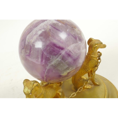 42 - A fluorspar crystal ball on a triform ormolu stand in the form of dogs, 4