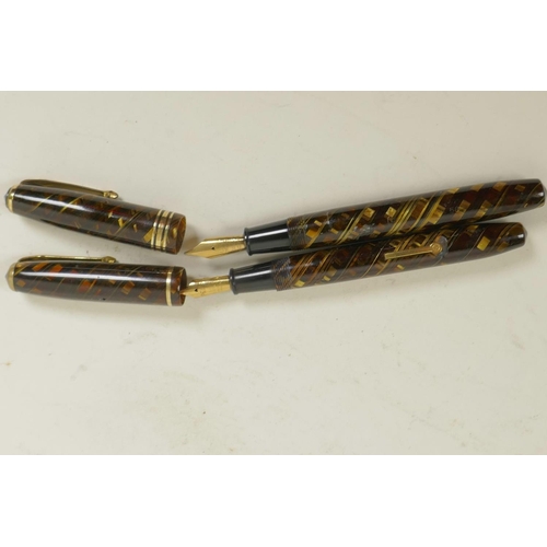 49 - A vintage 'Relief' tiger's eye fountain pen, no.12, with 14ct gold nib and a vintage Conway Stewart ... 