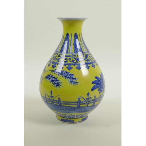 50 - A Chinese yellow glazed porcelain pear shaped vase with blue and white landscape decoration, seal ma... 