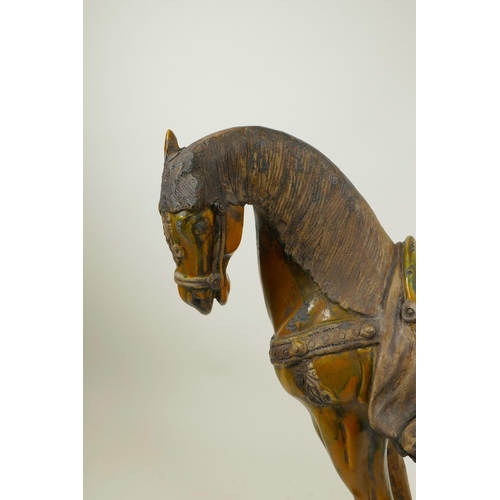 52 - A Chinese terracotta Tang horse with a Sancai glaze, 15½