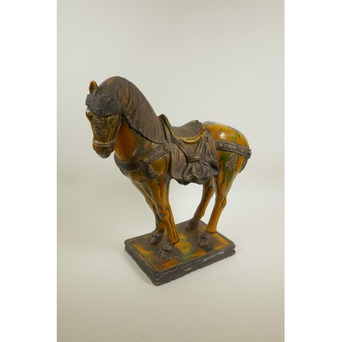 52 - A Chinese terracotta Tang horse with a Sancai glaze, 15½