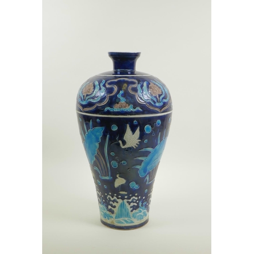 53 - A Chinese Fahua pottery meiping vase decorated with birds amongst a lotus pond, 14