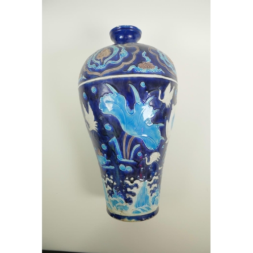 53 - A Chinese Fahua pottery meiping vase decorated with birds amongst a lotus pond, 14