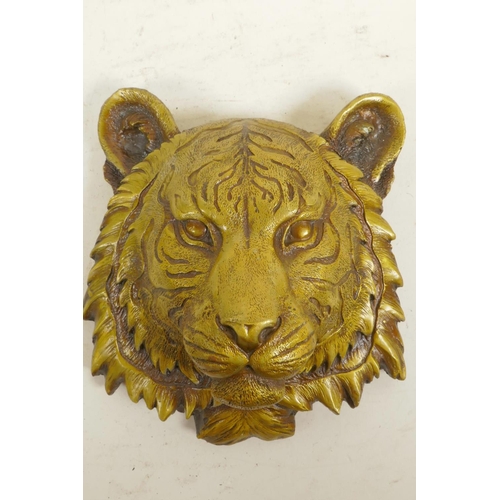 57 - A cast brass tiger's mask wall plaque, 7