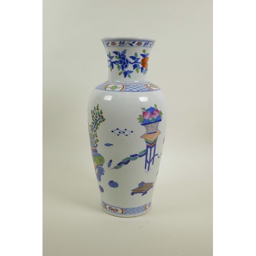 58 - A Chinese polychrome porcelain vase decorated with objects of virtu, auspicious flowers and fruit, 6... 