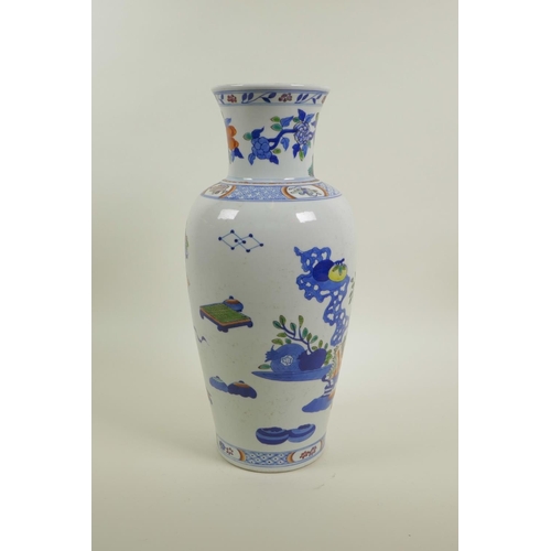 58 - A Chinese polychrome porcelain vase decorated with objects of virtu, auspicious flowers and fruit, 6... 