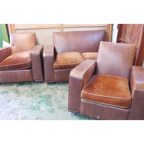 1159 - A 1930s leather and rexine three piece cottage suite, comprising a two seater settee and two tub cha... 