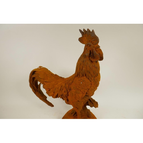 1 - A cast metal garden figure of a cockerel, 17½