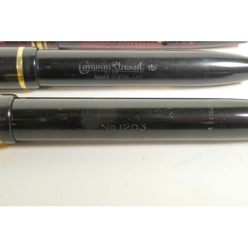 121 - Four Conway Stewart fountain pens and an Esterbrook 'Relief' model 12 fountain pen, all with 14ct go... 