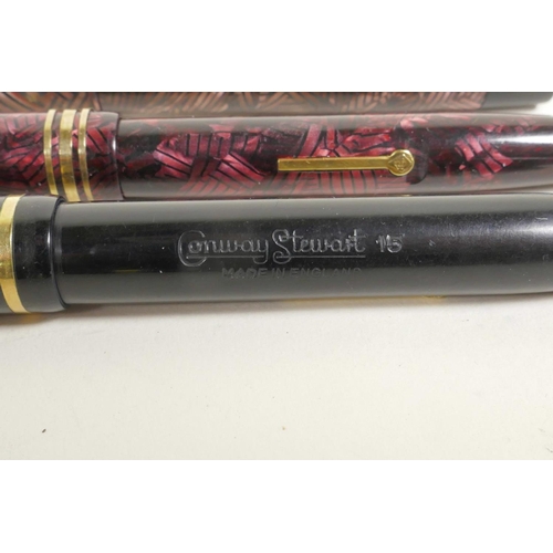121 - Four Conway Stewart fountain pens and an Esterbrook 'Relief' model 12 fountain pen, all with 14ct go... 