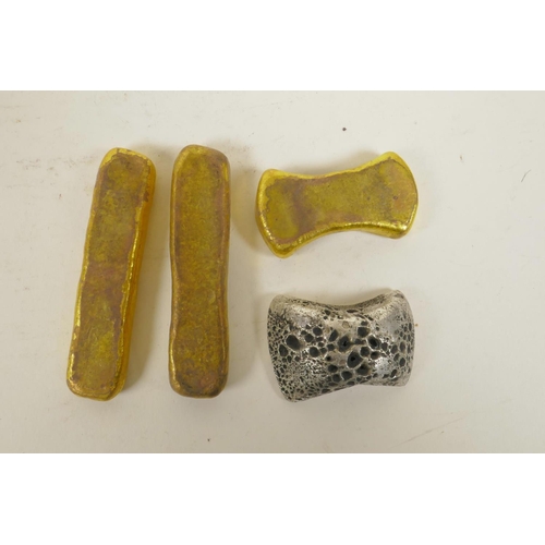 125 - Three Chinese gilt metal trade tokens/ingots, and another in white metal, largest 3½