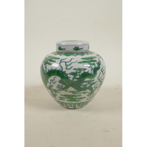 15 - A Chinese Ming style porcelain ginger jar and cover with green enamel dragon and flaming pearl decor... 