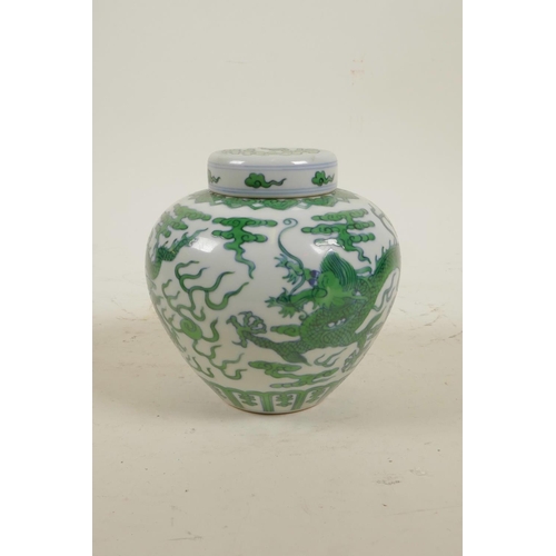 15 - A Chinese Ming style porcelain ginger jar and cover with green enamel dragon and flaming pearl decor... 