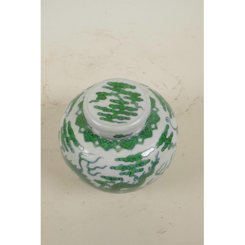 15 - A Chinese Ming style porcelain ginger jar and cover with green enamel dragon and flaming pearl decor... 