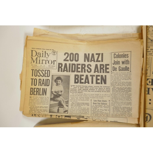 17 - A quantity of WWII era newspapers and three posters