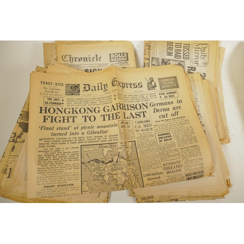 17 - A quantity of WWII era newspapers and three posters