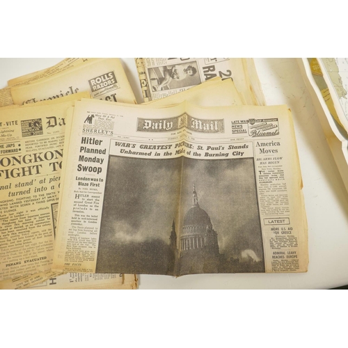 17 - A quantity of WWII era newspapers and three posters