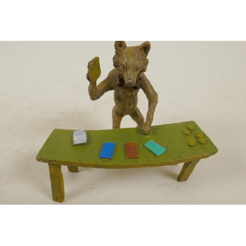 210 - An anthropomorphic cold painted bronze figure of a fox standing at a table dealing black jack cards,... 