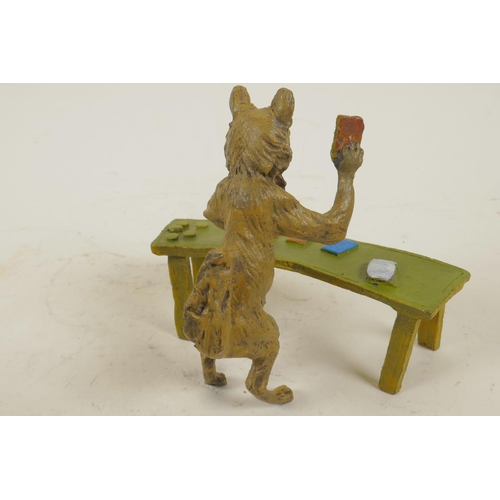 210 - An anthropomorphic cold painted bronze figure of a fox standing at a table dealing black jack cards,... 