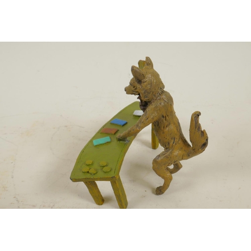 210 - An anthropomorphic cold painted bronze figure of a fox standing at a table dealing black jack cards,... 
