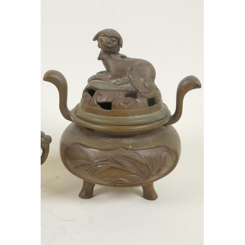216 - Two small Chinese bronze censers with cast covers, largest 3½