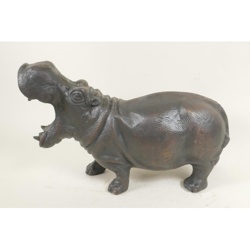 22 - A bronzed cast metal figure of a hippopotamus, 13½