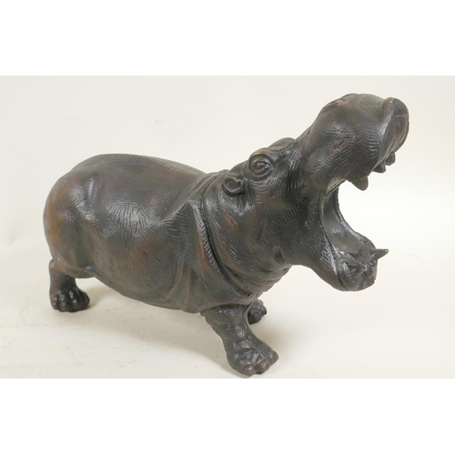 22 - A bronzed cast metal figure of a hippopotamus, 13½