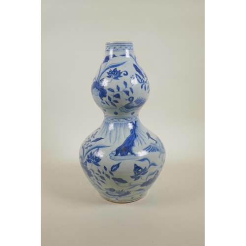 28 - A Yuan style blue and white double gourd vase with crane and lotus flower decoration, 13