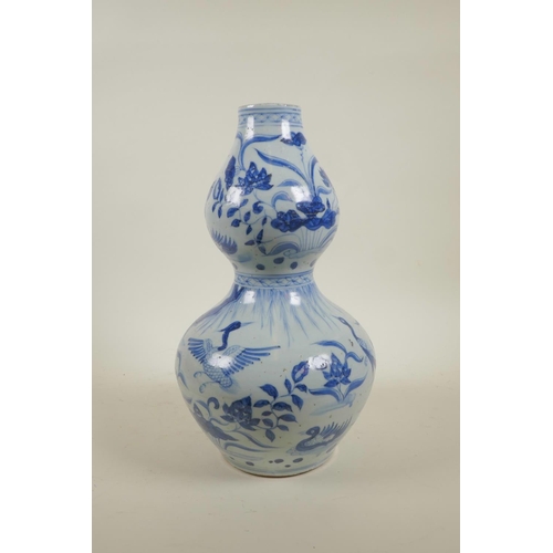 28 - A Yuan style blue and white double gourd vase with crane and lotus flower decoration, 13