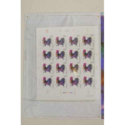 32 - A wallet of Chinese facsimile (replica) stamps commemorating the '2017 Year of the Rooster', 9