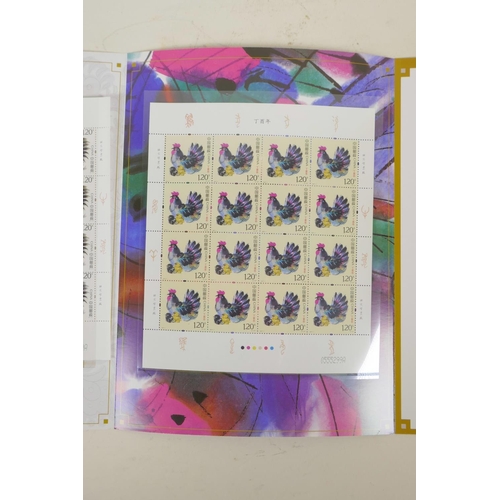 32 - A wallet of Chinese facsimile (replica) stamps commemorating the '2017 Year of the Rooster', 9