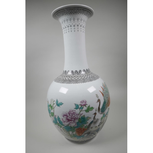 431 - A Chinese famille rose porcelain floor vase, mid C20th, painted with a pair of peacocks, peony bloss... 