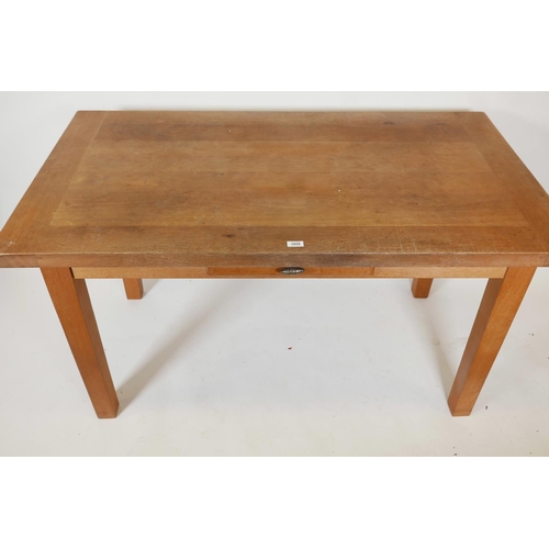 1243 - A contemporary oak dining table with single drawer, raised on tapering detachable supports,  55