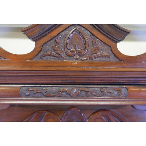 1253 - A Victorian walnut mirror backed sideboard with shaped top and bevelled glass over two moulded front... 