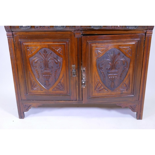 1253 - A Victorian walnut mirror backed sideboard with shaped top and bevelled glass over two moulded front... 