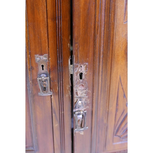 1253 - A Victorian walnut mirror backed sideboard with shaped top and bevelled glass over two moulded front... 