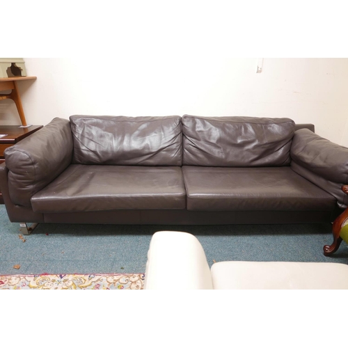 1251 - A Danish BoConcept Indivi brown leather sofa, on steel legs, 96½