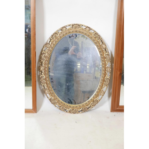 1152 - A gilt composition oval wall mirror and two other hall mirrors, largest 62