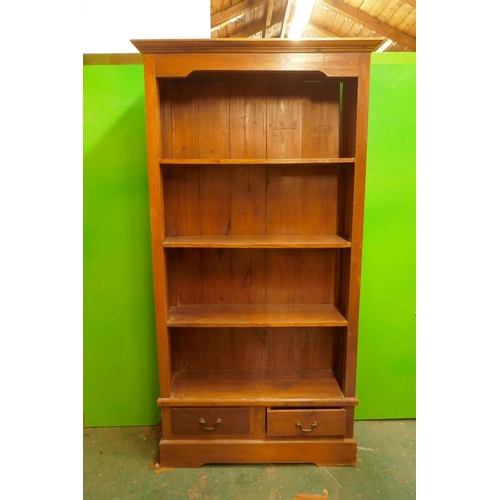 1154 - A hardwood open bookcase with fixed shelves and two drawers, 39