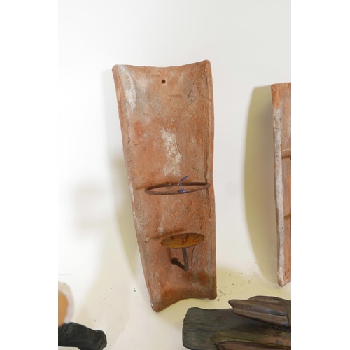 451 - A pair of terracotta and wrought iron pricket candle sconces converted from roof tiles, together wit... 